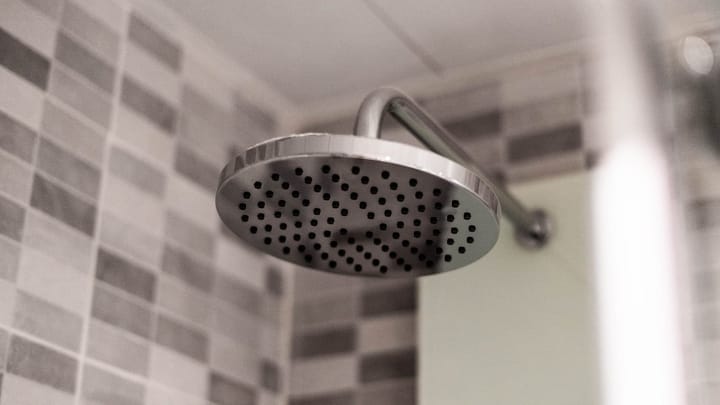 Shower head attached to a wall
